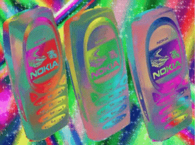 Three Nokia Cell Phones Are Lined Up In A Row GIF