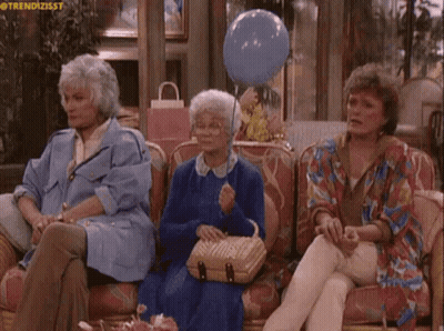Three Older Women Are Sitting On A Couch With A Blue Balloon GIF
