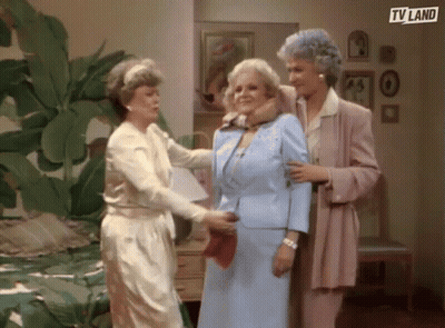 Three Older Women Are Standing Next To Each Other In A Bedroom . GIF