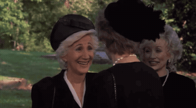 Three Older Women In Black Hats And Pearls Smiling GIF