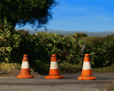 Three Orange And White Traffic Cones On Road GIF