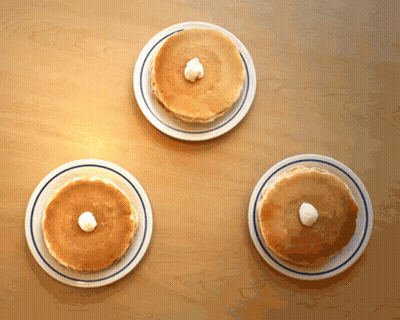 Three Pancake Plates With Whipped Cream GIF