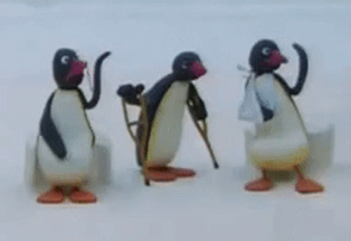 Three Penguins Are Standing Next To Each Other On The Snow GIF