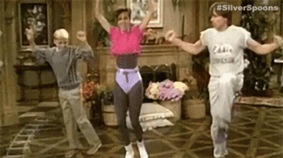 Three People Are Dancing Together In A Living Room . GIF