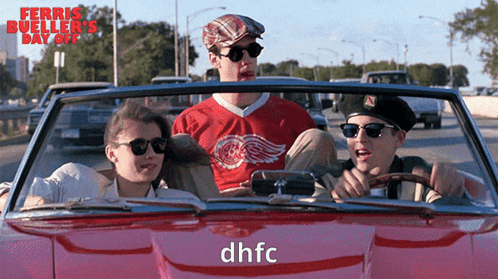 Three People In A Red Car With Dhfc On The Side GIF