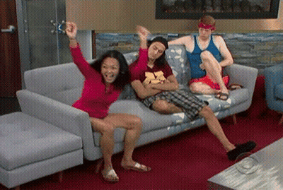 Three People On Couch One Wearing A Shirt GIF