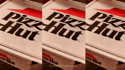 Three Pizza Hut Boxes Are Sitting On A Wooden Table GIF