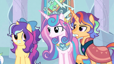 Three Ponies Standing Together One With Unicorn Horn GIF