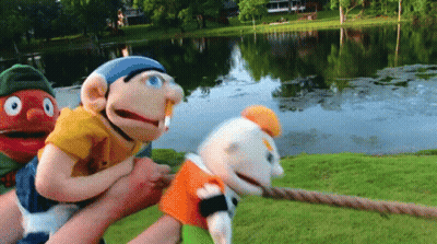 Three Puppets Pulled By Rope GIF
