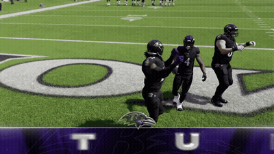 Three Ravens Players Standing On Football Field GIF