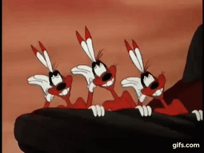 Three Red And White Cartoon Animals Sitting On Rock GIF