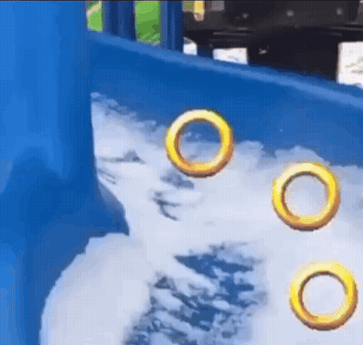 Three Rings Floating In Water On Playground Slide GIF