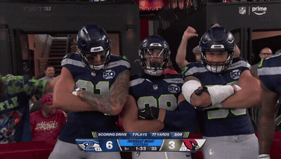 Three Seahawks Football Players Posing GIF