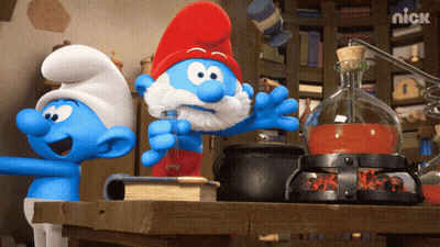 Three Smurfs Are Standing Around A Table With A Nick Logo On The Bottom Right GIF