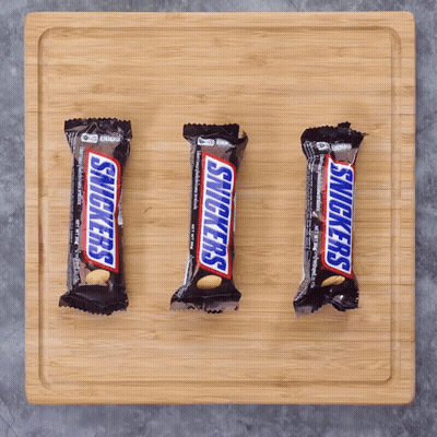 Three Snickers Bars Lined Up GIF
