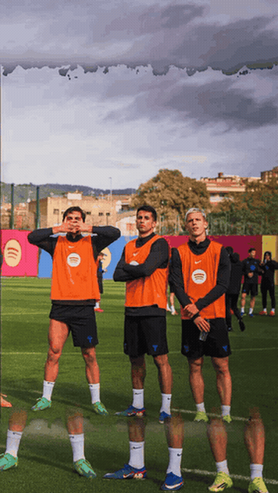 Three Soccer Players Wearing Orange Vests With Spotify Written On Them GIF