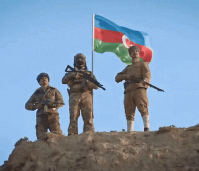 Three Soldiers Standing On Hill With Flag GIF