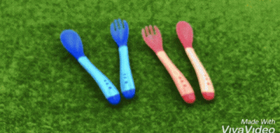 Three Spoons And A Fork On Green Surface GIF
