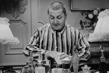Three Stooges Curly Putting Lotion On Face GIF