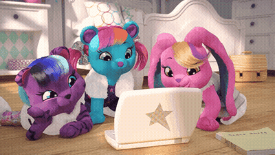 Three Stuffed Animals Are Looking At A Laptop With A Star On The Front GIF