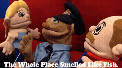 Three Stuffed Animals Are Sitting On A Couch With The Words The Whole Place Smelled Like Fish Below Them GIF