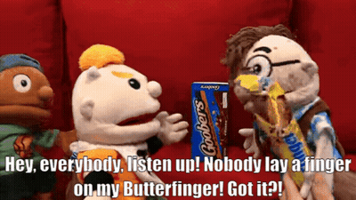 Three Stuffed Animals Are Standing Around A Box Of Grobers Chocolate Bars GIF