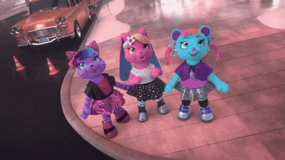 Three Stuffed Animals Are Standing Next To Each Other On A Street GIF