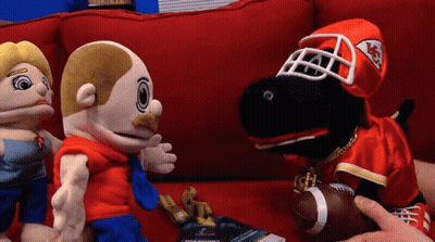 Three Stuffed Animals On Red Couch With Chiefs Uniform GIF