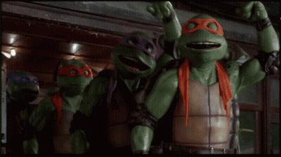 Three Teenage Mutant Ninja Turtles Standing By TV GIF