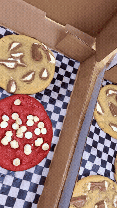 Three Types Of Cookies In A Box On Checkered Paper GIF