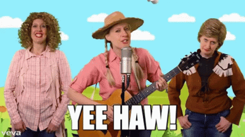 Three Women Are Singing And Playing Guitar In Front Of A Microphone With Yee Haw Written On The Bottom GIF