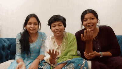 Three Women Are Sitting On A Couch And One Of Them Is Wearing A Wedding Ring GIF