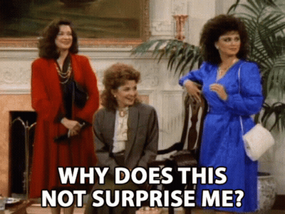 Three Women Are Standing In A Living Room And One Of Them Is Asking Why Does This Not Surprise Me GIF