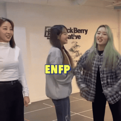 Three Women Are Standing In Front Of A Blackberry Creative Sign GIF