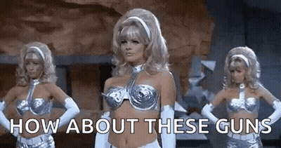 Three Women Are Standing Next To Each Other With Their Hands On Their Hips And The Words `` How About These Guns '' Abov GIF