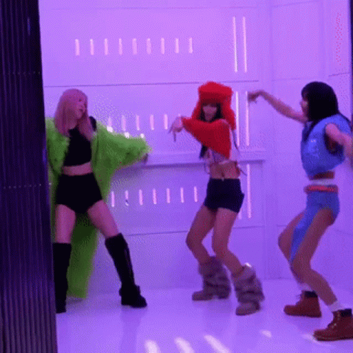 Three Women Dancing In Front Of Purple Wall GIF