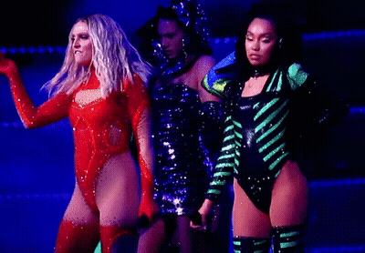 Three Women Dancing On Stage One In Red Leotard GIF