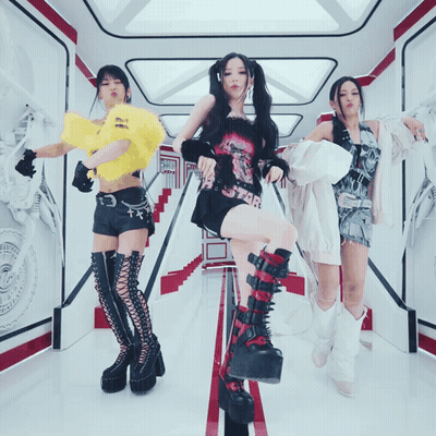 Three Women Dancing, One In Star Shirt GIF