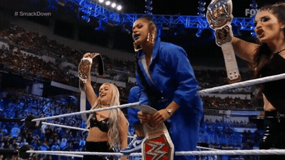 Three Women Holding Championship Belts In Wrestling Ring GIF