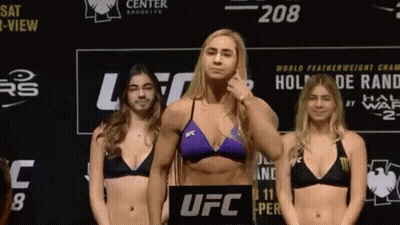 Three Women In Bikinis On Scale GIF