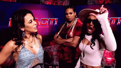Three Women In Front Of Sign Saying I Act GIF