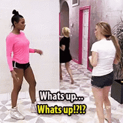 Three Women In Hallway One In Pink Shirt GIF