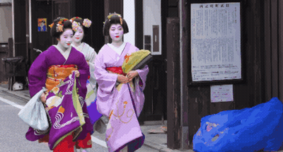 Three Women In Kimonos Walking Past Chinese Sign GIF