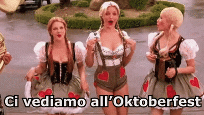 Three Women In Oktoberfest Costumes Standing Together GIF