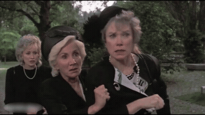 Three Women In Park One Wearing Feather Hat GIF
