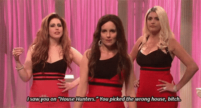 Three Women In Red Dresses Talking About House Hunters GIF