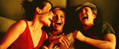 Three Women Laughing One With Arm Tattoo GIF