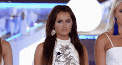 Three Women, One Wearing Earrings GIF