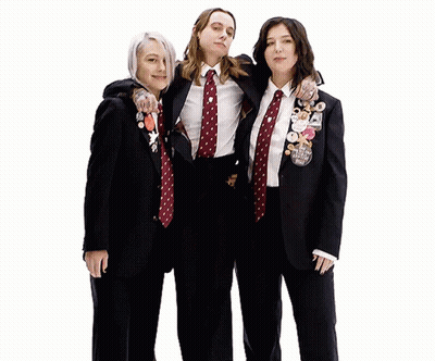 Three Women Posing One With I Love You Badge GIF