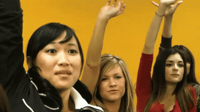 Three Women Raising Hands in Air